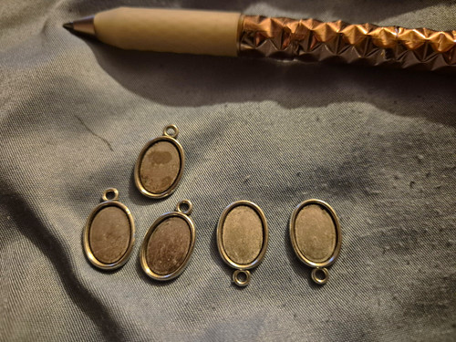 Silver tone oval metal - tone,